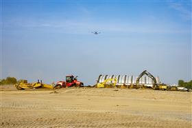 Haines & Kibblehouse, Inc.: A scraper tractor works among other equipment at the Southport Project.