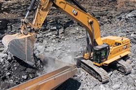 Pottsville Quarry & Asphalt: A Caterpillar 395 loads a Caterpillar 777F with shot rock.