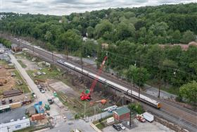 Structures Division: A Structures Division crew works on sheet piling along an Amtrak mainline.