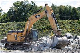 Bedrock Quarry: A Caterpillar 349F sorts through material. 