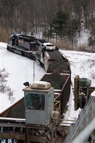 Birdsboro Quarry: The engineer spots rail hoppers for loading while to operator of the load out system checks the aggregate hoppers.