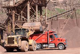 Blooming Glen Quarry: A Caterpillar 980G loads a dump truck with stone. 