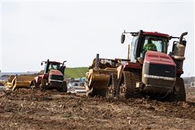 Harrisburg Division: Twin Case IH 580 QuadTrac tractors pull K-Tec 1228 scrapers. 