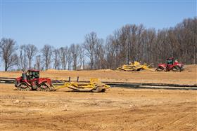 Pottstown Division: Two Case IH Steigers unload their scrapers on a pad. 