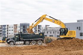 Pottstown Division: A Caterpillar 335 loads material into a Mack Granite dump truck.