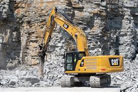 Hilltop Quarry: A Caterpillar 336 excavator sorts through large rock and hammers it down to a smaller material.