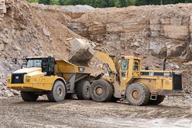 Hazleton Quarry & Eckley Asphalt: A Caterpillar 745 is loaded with shot rock by a Caterpillar 988F.