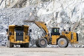 Penn/MD Quarry: A Caterpillar 988K loads a Caterpillar 772G with shot rock in the pit at Penn/MD Quarry.