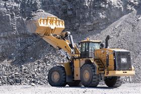 Naceville Quarry: A Caterpillar 988K awaits a haul truck which will move the shot rock to the primary crusher for further processing. 