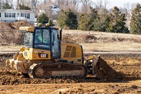 Pottstown Division: A Caterpillar D5K2 grades dirt.