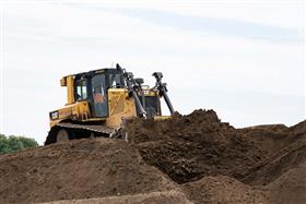 Haines & Kibblehouse, Inc.: A Caterpillar D6TXW LGP dozer works in a basin.