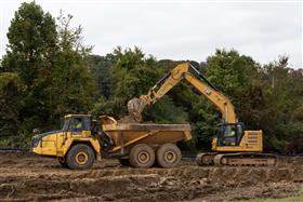 Pottstown Division: A Caterpillar 335 works a cut with a Komastu HM400.