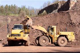 Blooming Glen Quarry: A Caterpillar 988F loads a haul truck with shot rock.