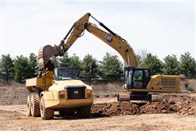 Chalfont Quarry & Asphalt: A Caterpillar 336 loads stripped topsoil into a Caterpillar 740 articulated truck.