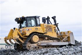 Landis C. Deck & Sons Division: A Caterpillar D6 stacks a stone pile. 