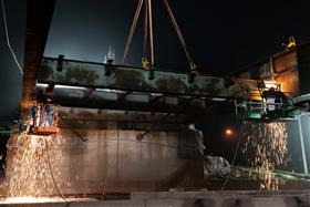 Structures Division: A Structures Division crew cuts old bridge beams. 