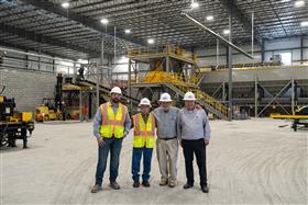 Easton Block & Supply: Easton Block & Supply management pose with H&K co-founder John B. Haines IV during a tour of the new facility. 