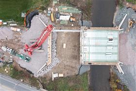 Structures Division: A Structures Division crew places precast concrete beams on the SR443 realignment project. 