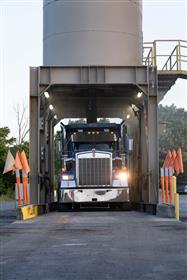 South Reading Asphalt: A Kenworth triaxle gets loaded with asphalt under the silos at South reading Asphalt. 