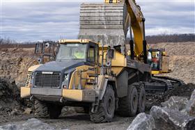 Pottsville Quarry & Asphalt: A Komatsu HM400 is loaded with shot rock. 