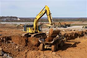 Harrisburg Division: A Komatsu PC650 loads a Komatsu HM400 with dirt.