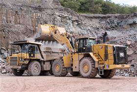 Locust Ridge Quarry & Asphalt: A Caterpillar 769D is loaded with shot rock by a Caterpillar 988K.