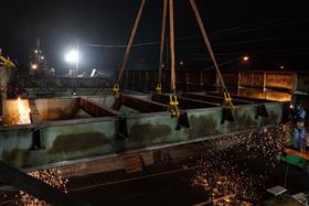 Structures Division: A Structures Division crew cuts beams out during a bridge demolition.